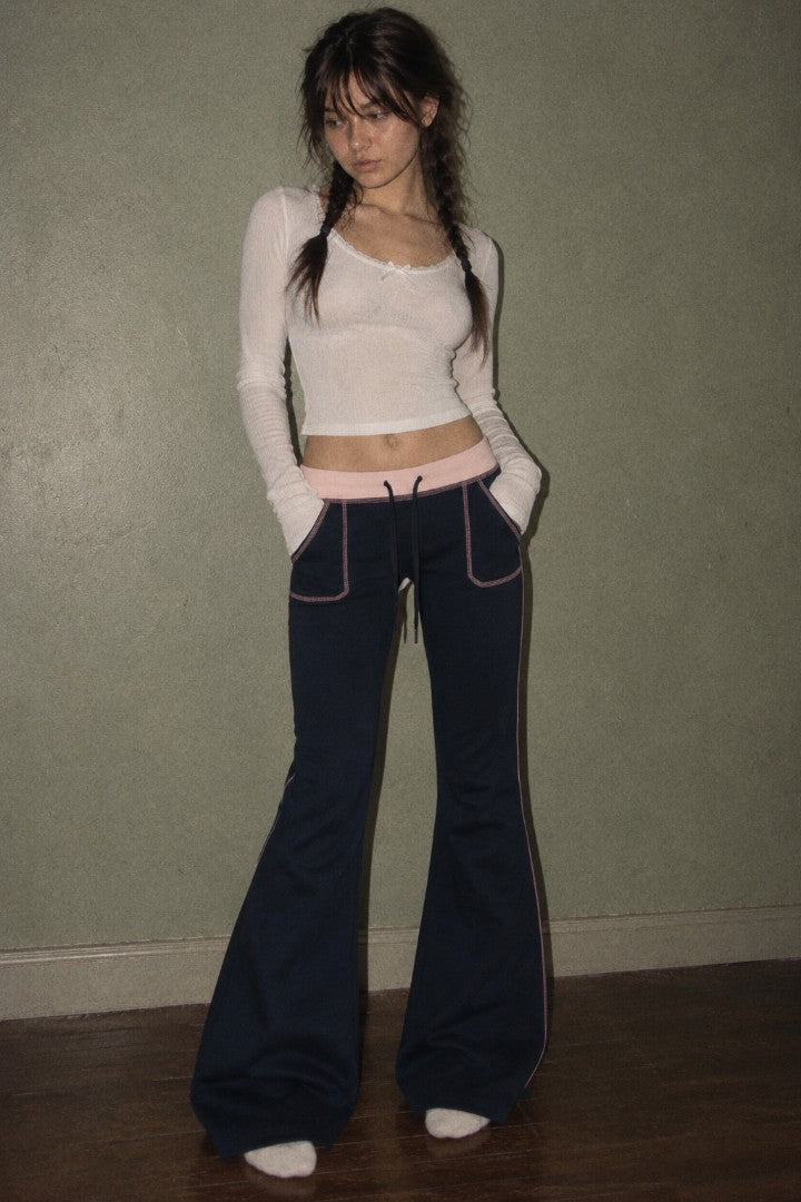 Blue Monday navy low rise bootcut pants with baby pink waistband and patch pockets